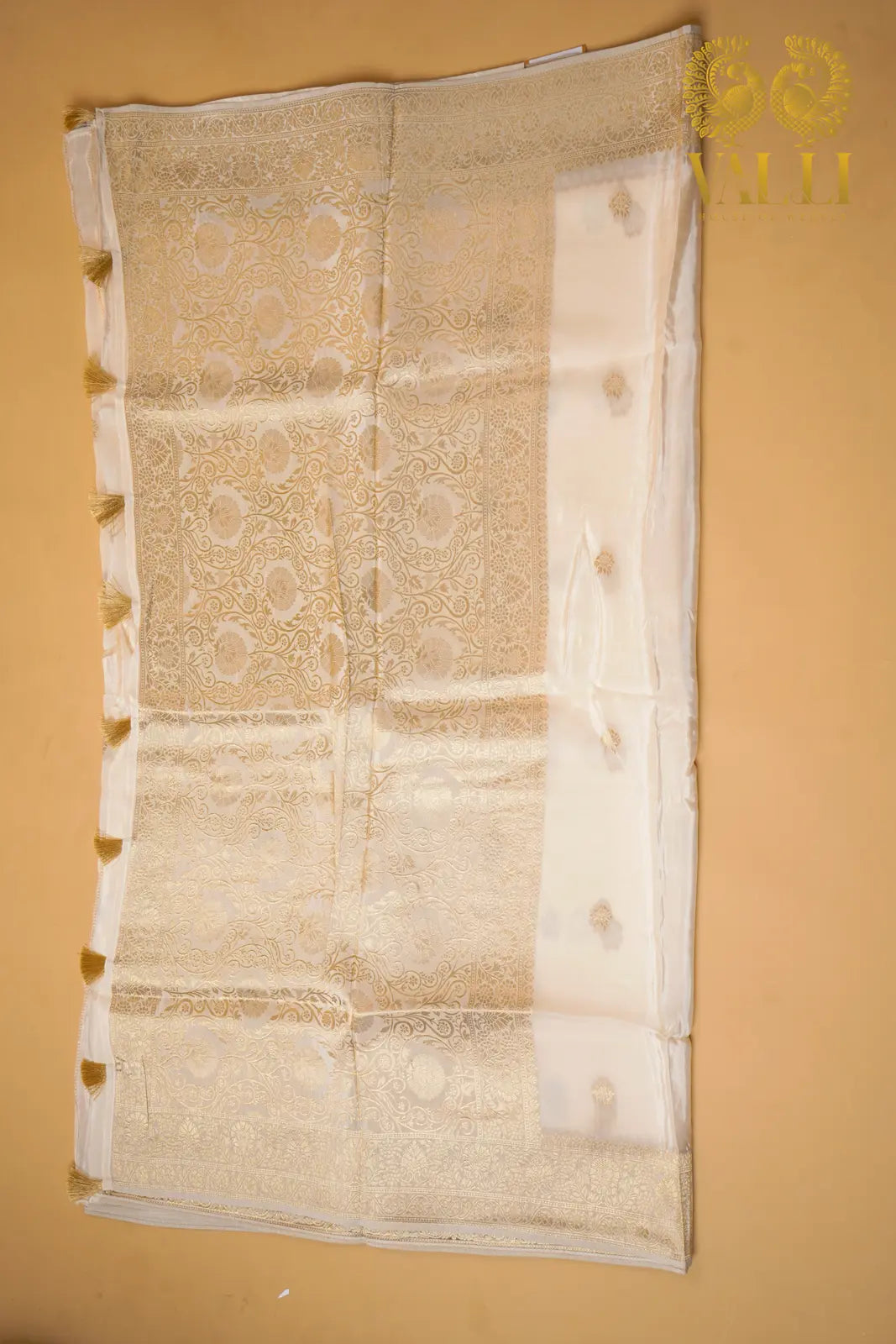 White satin crepe with gold Zari border