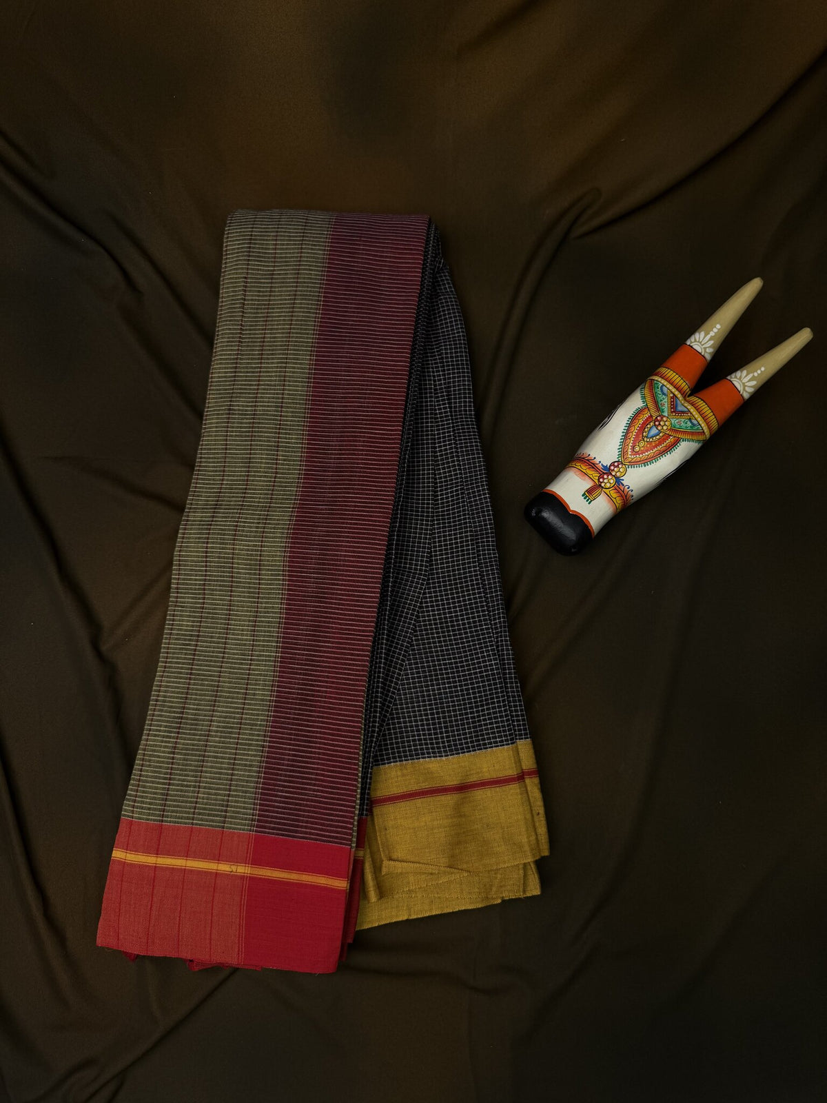 patteda anchu blsck check yellow and red boarder saree