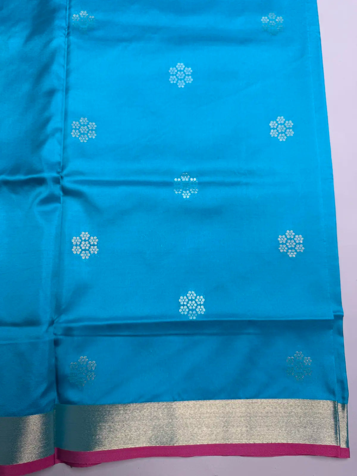 Teal Blue Soft Silk Saree with Floral Motifs & Rich Pink Pallu