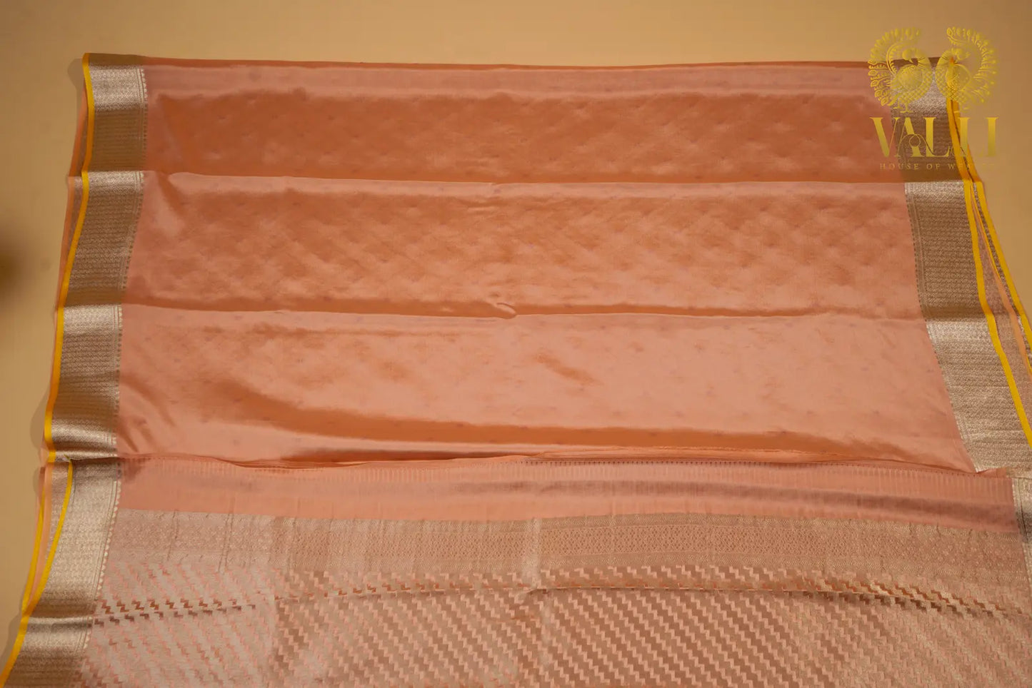 Pastel Peach Banarasi Crepe Silk Saree with Yellow Selvage‘