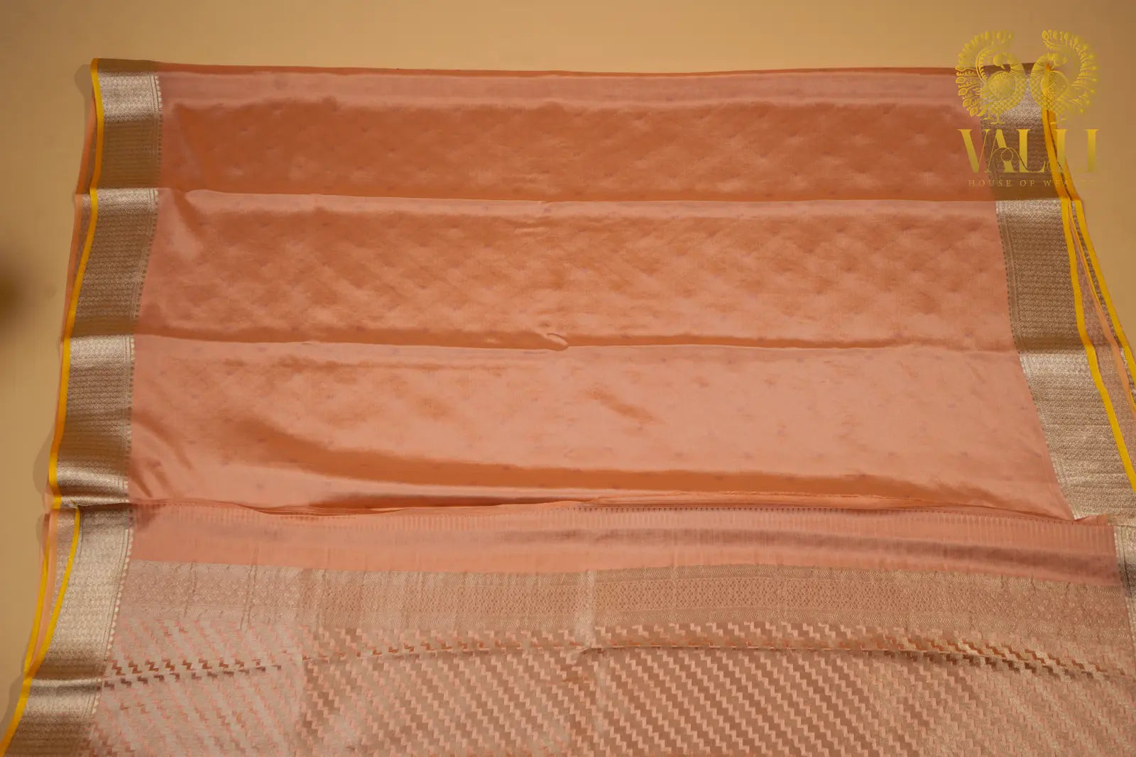 Pastel Peach Banarasi Crepe Silk Saree with Yellow Selvage‘