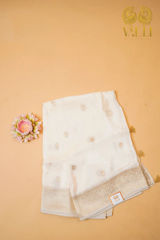 White satin crepe with gold Zari border