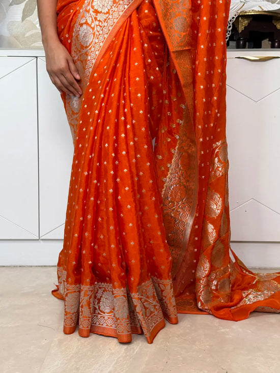 Banarasi Georgette Saree – Vibrant Orange with Silver Zari Motifs