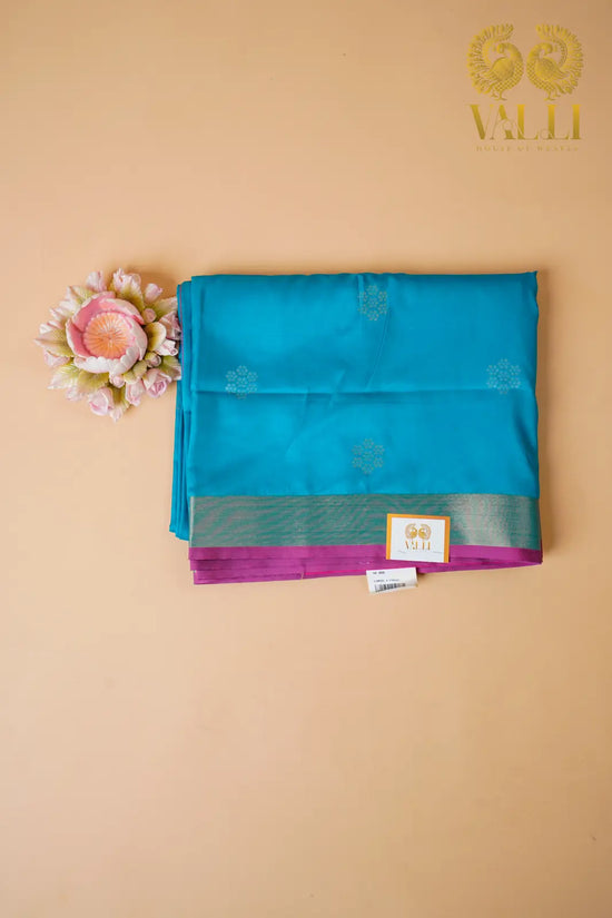 Teal Blue Soft Silk Saree with Floral Motifs & Rich Pink Pallu