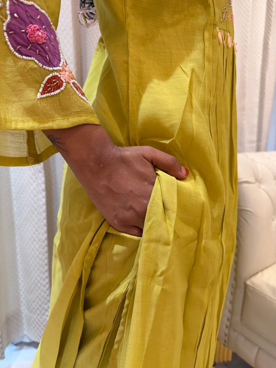 Lemon green  salwar set with pearl work v neck. A LINE SALWAR