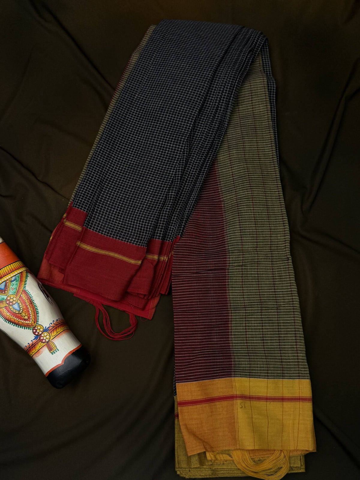 patteda anchu blsck check yellow and red boarder saree