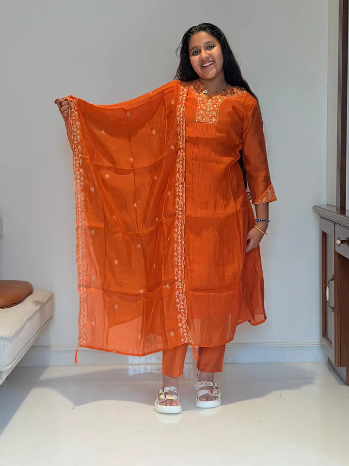 Orange A  line salwar set v neck pattern