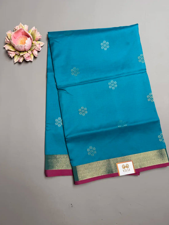 Teal Blue Soft Silk Saree with Floral Motifs & Rich Pink Pallu